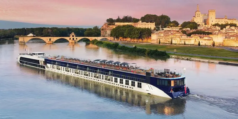 A small ship floats down-river