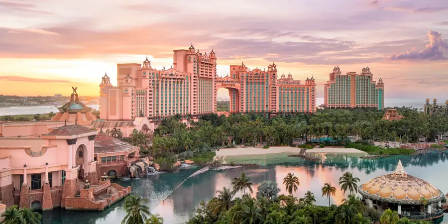 A colorful sky dazzles behind the main towers at Atlantis Bahamas